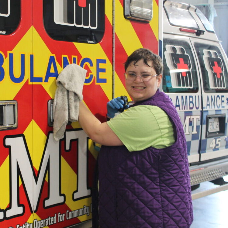 Sarah volunteering to clean ambulance